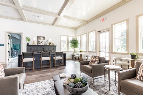 a living room with couches and chairs and a table